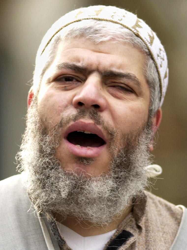 Muslim cleric Abu Hamza al-Masri leads Friday prayers outside the Finsbury Park Mosque in London in this Feb. 7, 2003, file photo.