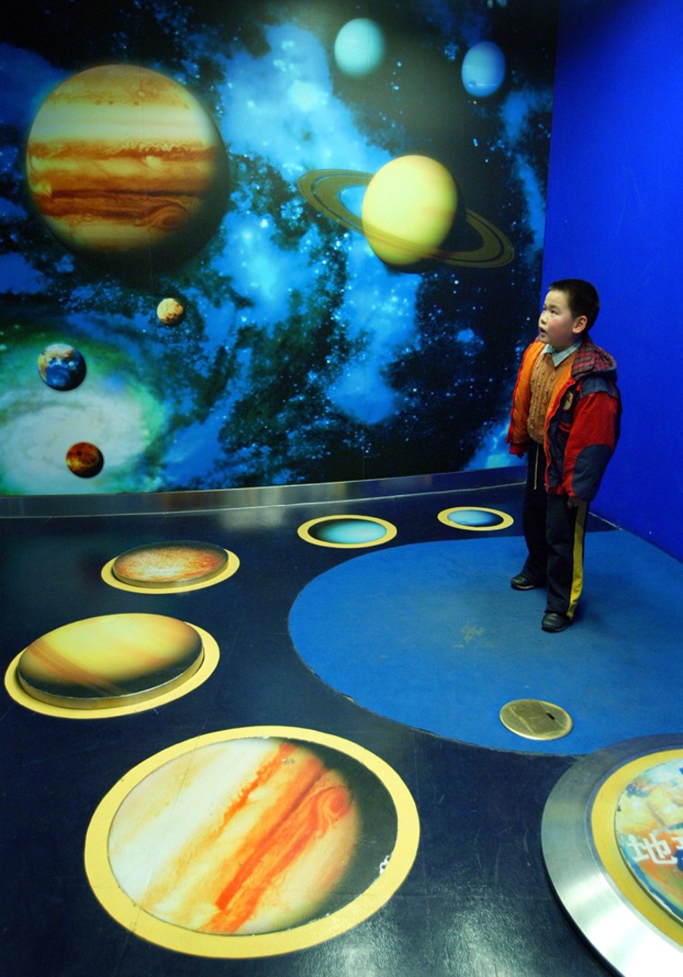 A Chinese boy plays in the Shanghai Science and Technology Museum