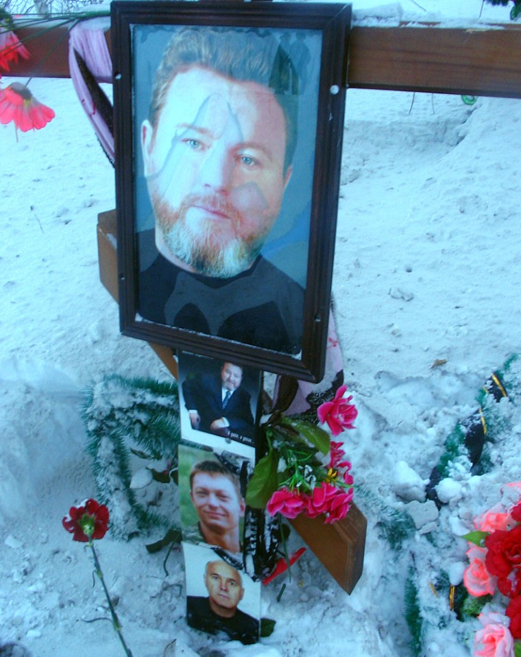 A roadside memorial for Altai Gov. Mikhail Yevdokimov; his bodyguard, Alexander Ustinov; and his driver, Ivan Zuev, who were killed Aug. 7 in a car crash at the site. The driver of the other car in the accident was sentenced to four years in prison this month, a sentence that sparked nationwide protests this weekend.