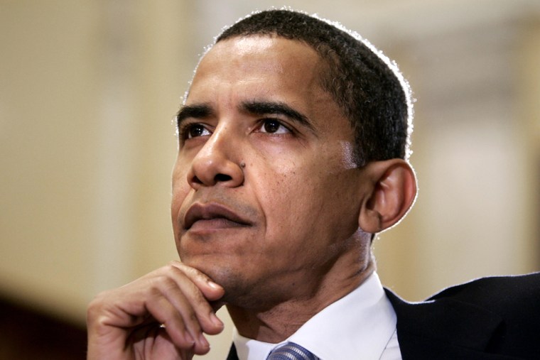Barack Obama listens during a Senate hearing on lobbying