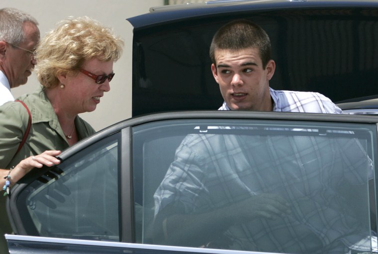 Dutch teen Joran van der Sloot, 18, enters his family's car as his mother Anita closes the door after he was conditionally released from the KAI jail in San Nicolas, Aruba, Saturday, Sept. 3, 2005. Sloot, who was jailed since June 9 in connection with the disappearance of American teen Natalee Holloway, remains a suspect but is free under the condition that he not leave the island and remain available to the police. (AP Photo/Leslie Mazoch)