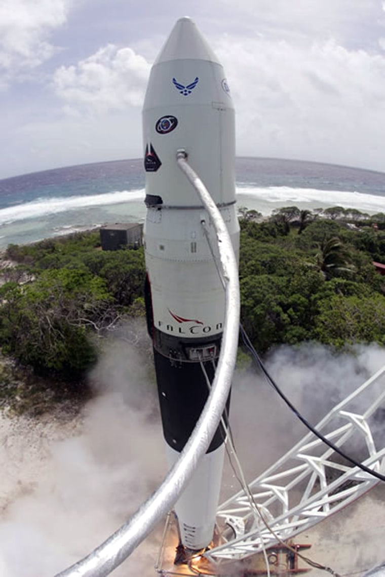 The Falcon 1 rocket's engine fires briefly during a static-fire test on SpaceX's launch pad in Kwajalein Atoll.