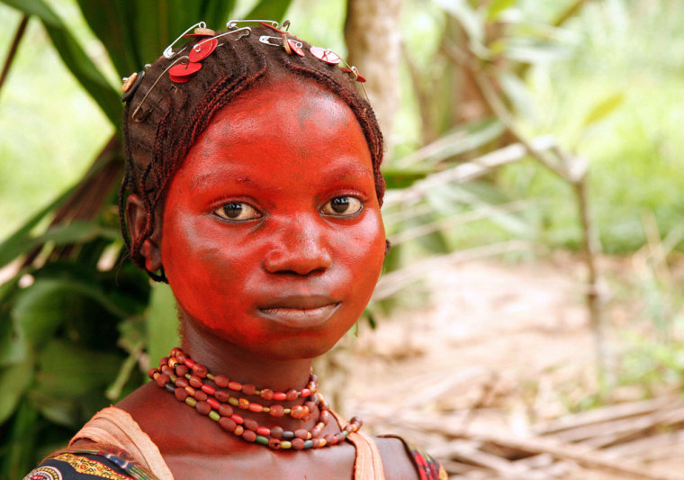Pygmies like this woman in the Congo village of Mpha have historically been neglected and are largely ignorant about laws that could protect them and their ways. 