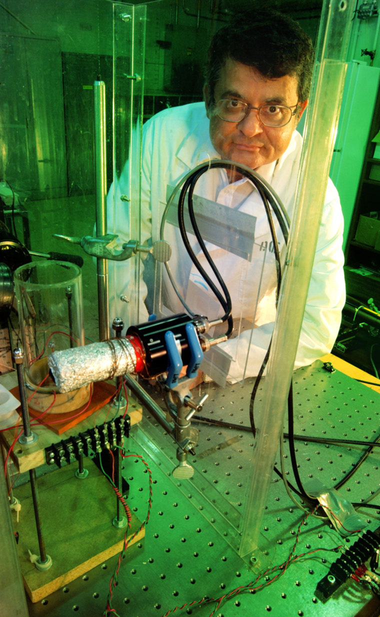 Rusi Taleyarkhan, a professor of nuclear engineering at Purdue University, has led research purporting to show evidence of nuclear fusion reactions in a tabletop experiment. Taleyarkhan is shown here with his experiment in a U.S. Department of Energy facility in Oak Ridge, Tenn., where he conducted the research before coming to Purdue.