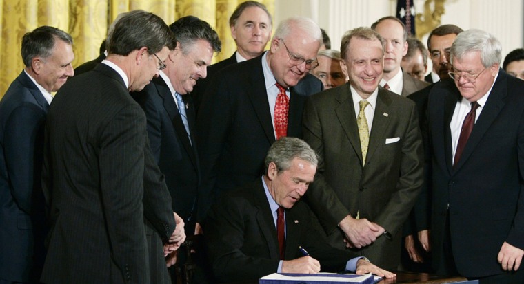 U.S. President George W. Bush prepares to sign the Patriot Act at the White House in Washington