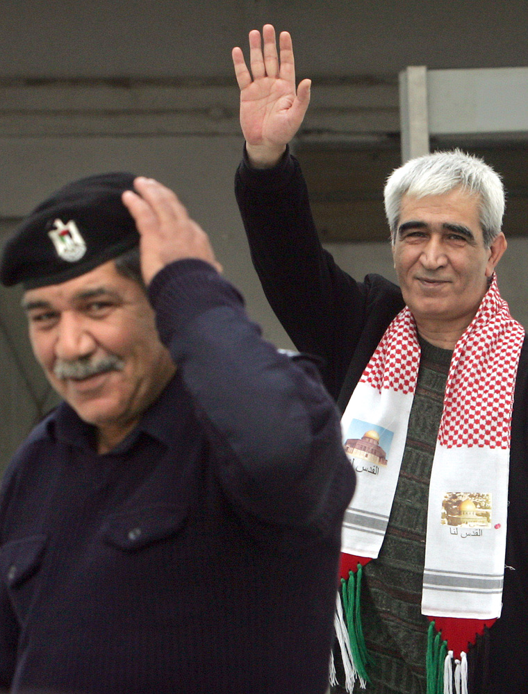 ** FILE ** Head of the Popular Front for the Liberation of Palestine, Ahmed Saadat, is seen at a prison in the West Bank town of Jericho, in this Jan. 25, 2006 file photo. Israeli forces raided the prison Tuesday March 14, 2006, demanding the surrender of six prisoners, including Saadat, inside and sparking a shootout with Palestinian police that left one Palestinian officer dead and another man wounded, Palestinian security officials said. Saadat is being held for ordering the assassination of Israeli Tourism Minister Rehavam Zeevi in 2001.  (AP Photo/Kevin Frayer)