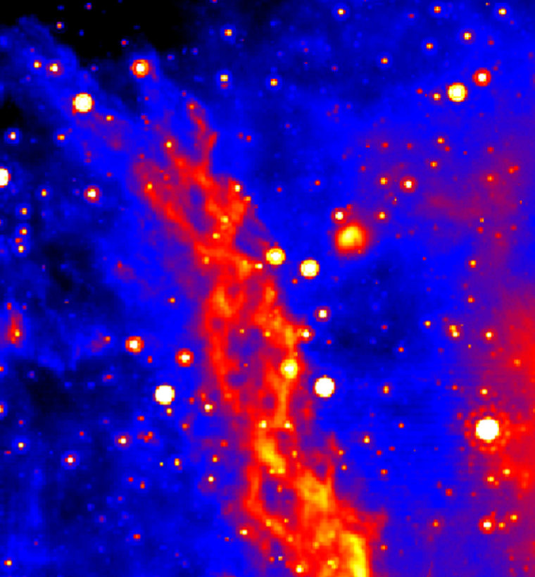 A nebula's double helix shape is emphasized in this false-color, infrared image of a region  about 300 light-years from the Milky Way's central black hole.