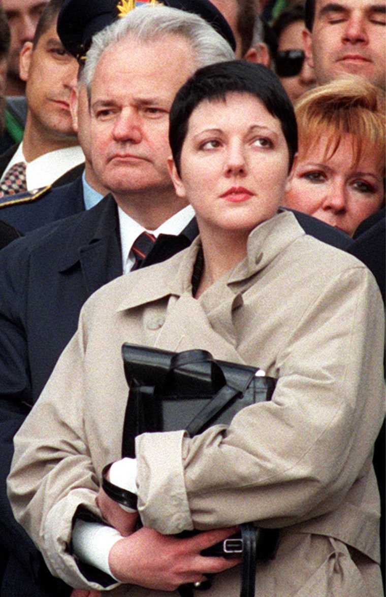 ** FILE ** Former Serbian leader Slobodan Milosevic, left, with his daughter Marija, right attend a funeral in Belgrade in this April 1997 file photo. Milosevic's daughter on Sunday called her father's funeral in Serbia \"scandalous\" and blasted the rest of the family for arranging it. (AP Photo/Darko Vojinovic)