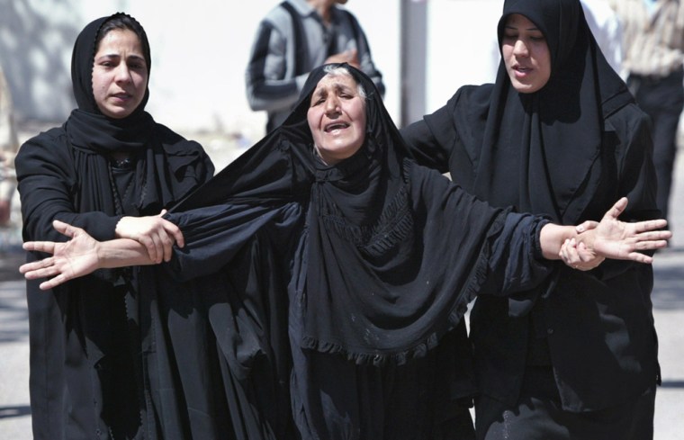 Woman cries outside hospital after relative was killed in suicide car bomb attack in Baghdad
