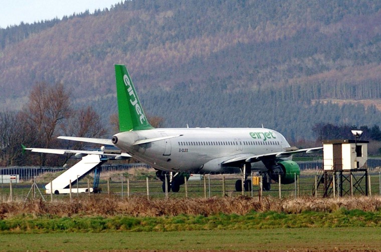 The Eirjet airliner that left Liverpool on Wednesday bound for Derry in Northern Ireland is seen at Ballykelly Army Base after landing there by accident Wednesday.