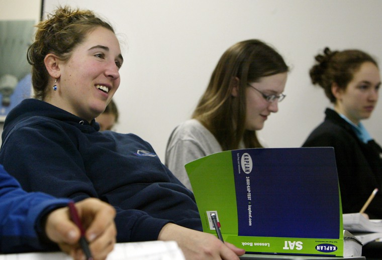 Emma Notis-McConarty, 17, of Newton, Mass., left, smiles Sunday during her final SAT prep class at Kaplan Test Prep and Admissions. Test-takers are more anxious than usual; more than 4,000 tests were wrongly scored.