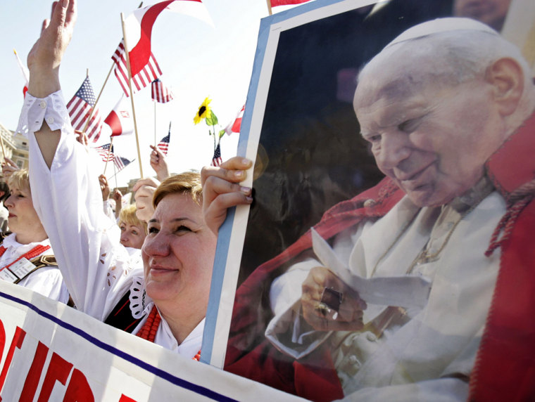 Member of Chicago's Polish community waves as Pope Benedict XVI appears at the Vatican