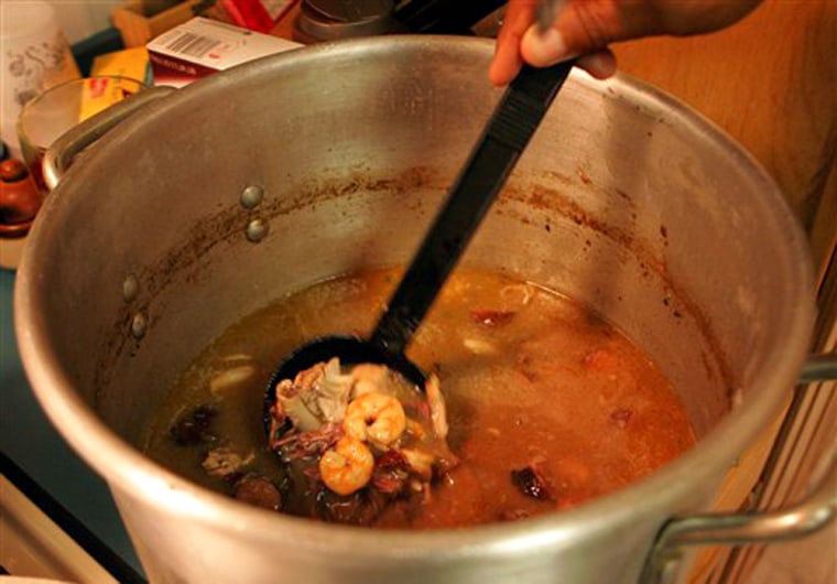 A pot of gumbo cooks on the stove at Mytle Bossier's home in Edgard, La., March 16, 2006. Bossier hosted a party for friends from New Orleans who talked about how Hurricane Katrina had changed the lives of friends and families in the black community. (AP Photo/Bill Haber)