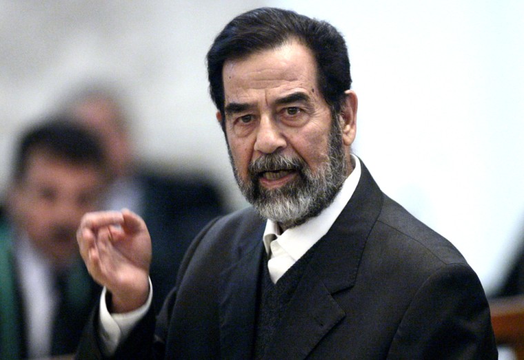 Former Iraqi President Saddam Hussein testifies during cross-examination at his trial held in Baghdad's heavily fortified Green Zone, Wednesday April 5, 2006. Saddam Hussein was cross-examined for the first time in his six-month-old trial Wednesday, saying he approved death sentences against Shiites in the 1980s because he believed the evidence had proven they were involved in an assassination attempt against him. (AP Photo/ David Furst, Pool)