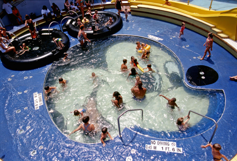 Passengers in the Mickey Mouse pool aboard the Disney cruise ship Disney Magic.