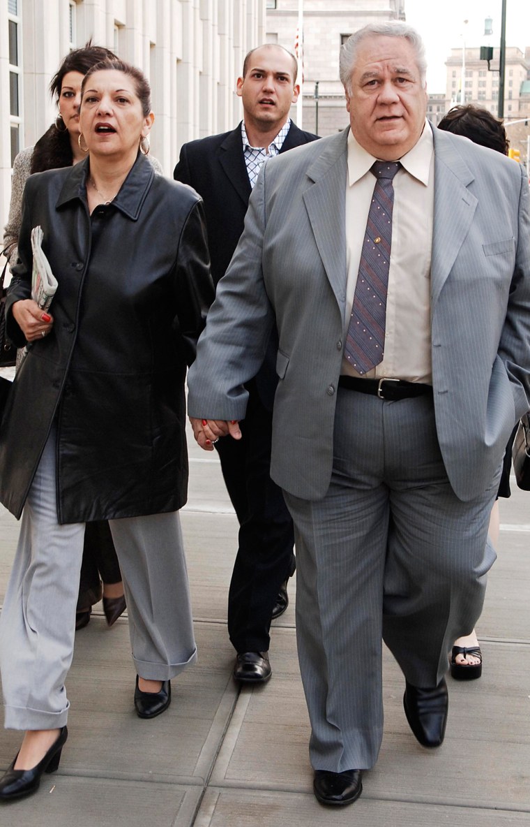 Former New York City police detective Louis Eppolito enters Brooklyn federal court with his wife, Fran, on Wednesday in New York.