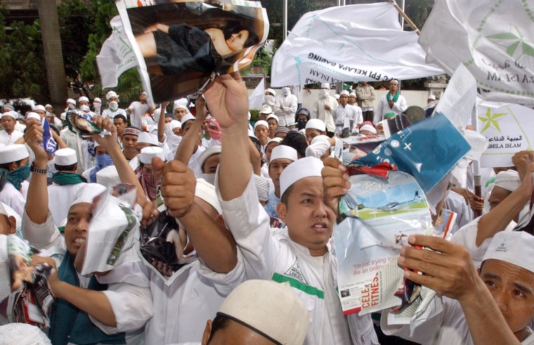 MUSLIM PROTESTERS TEAR PLAYBOY APART
