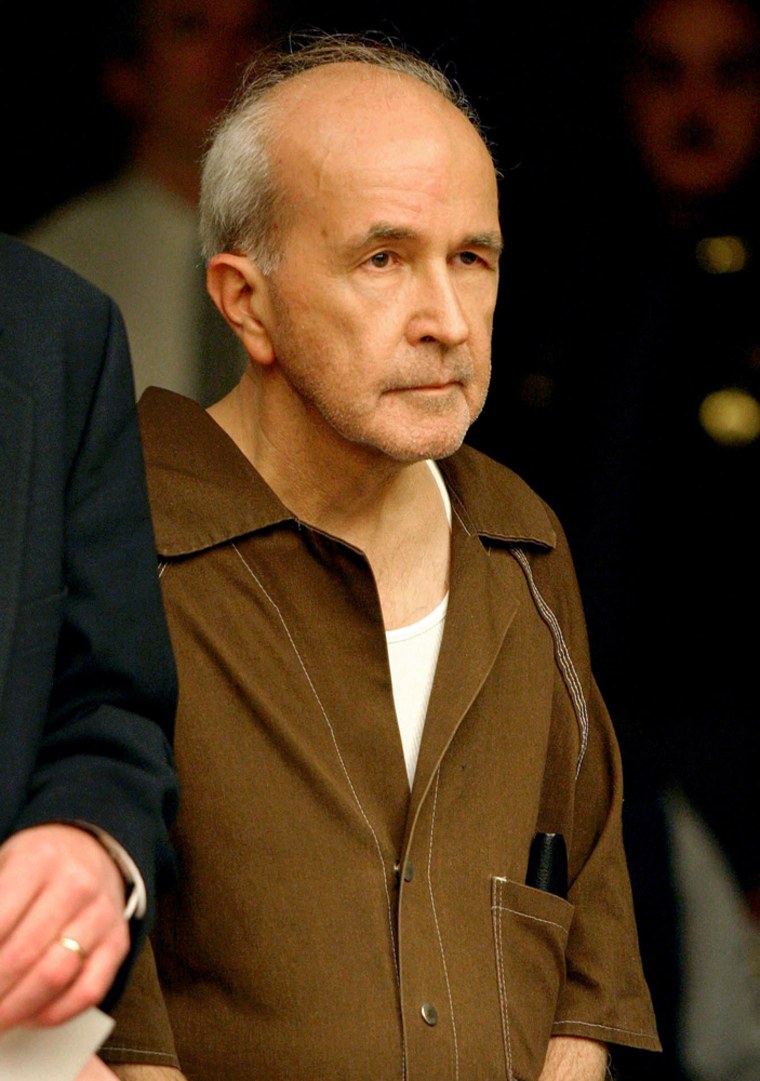 The Rev. Gerald Robinson, shown during a court appearance on April 26, 2004, is accused of killing Sister Margaret Ann Pahl, who was strangled and stabbed about 30 times on April 5, 1980. 