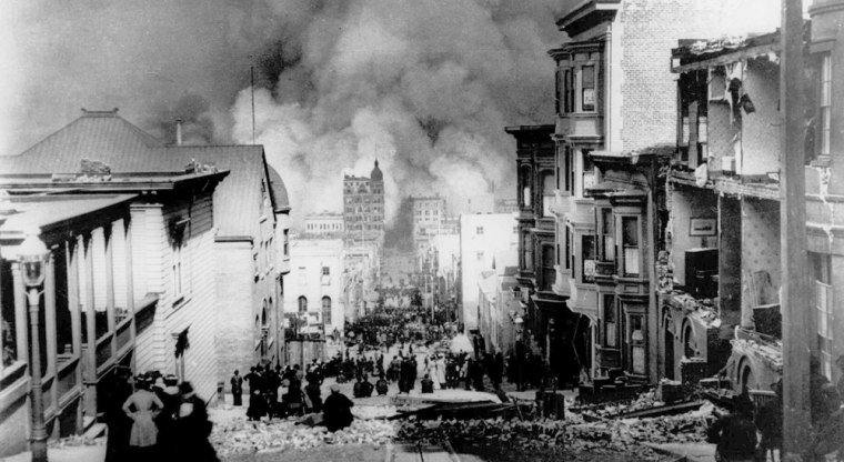 People on Sacramento street watch smoke rise from fires after a severe earthquake in San Francisco, on Wednesday, April 18, 1906. The quake measured 8.3 on the Richter scale igniting fires that proved far more disastrous.