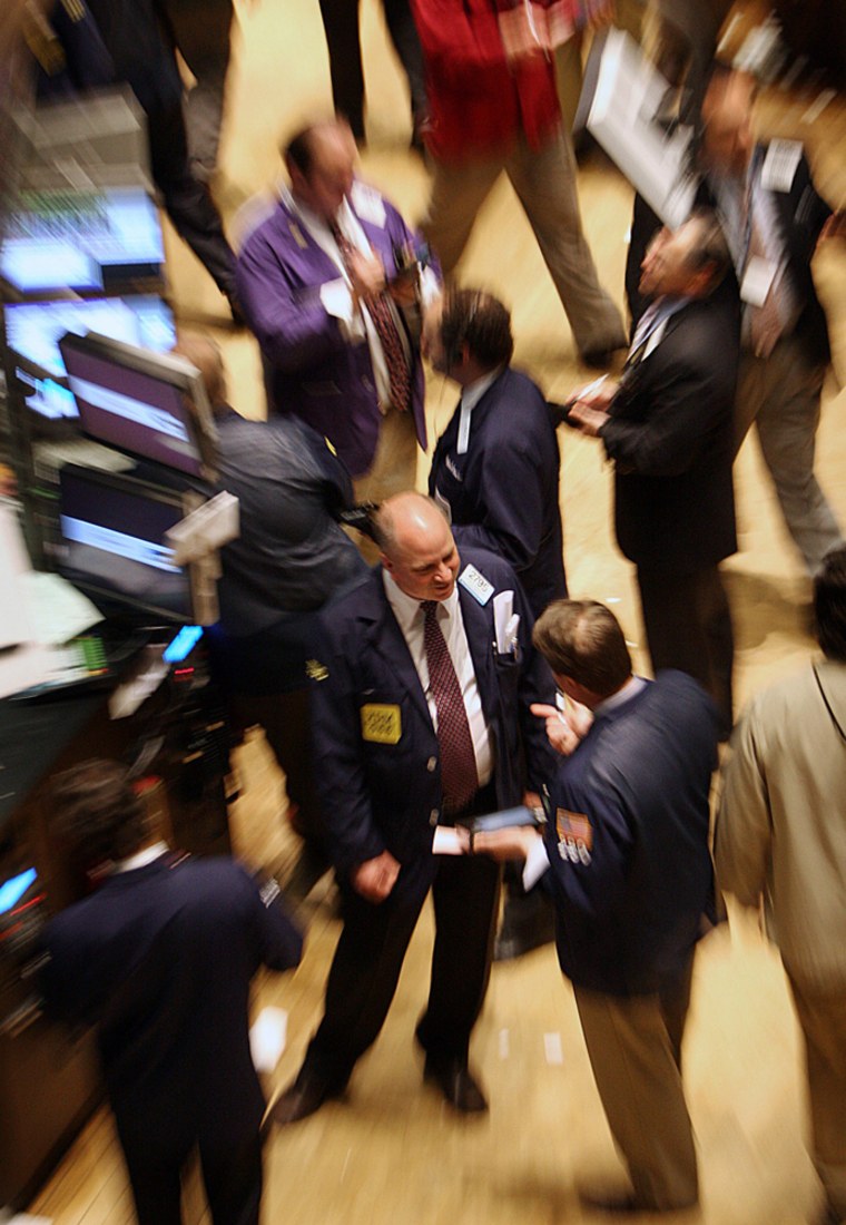 Traders and specialist work on floor of New York Stock Exchange in New York