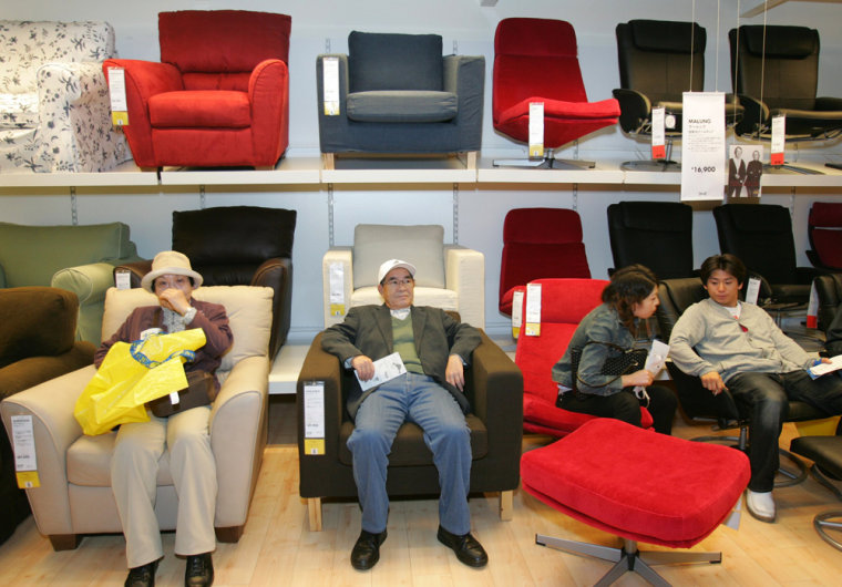 Japanese shoppers sit on IKEA's sofas at store in Funabashi