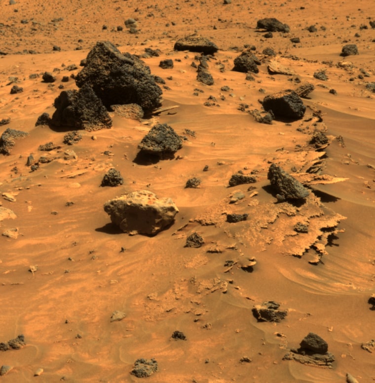 At least three different kinds of rocks await scientific analysis at the place where NASA's Mars Exploration Rover Spirit will likely spend several months of Martian winter. Thin-layered, jagged-edged rocks, rounded gray rocks and lavalike rocks are all visible in this picture, taken April 12.