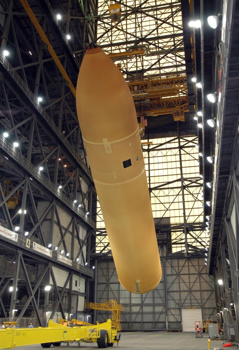 The external fuel tank, seen earlier this year at the Kennedy Space Center's Vehicle Assembly Building, has already had several changes made to it since last year's space shuttle flight.
