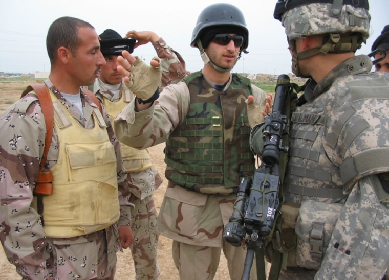 Lt. Aaron Tapalman, 23, argues with some Iraqi soldiers about who will deal with a suspected roadside bomb on a highway near the northern city of Hawijah.