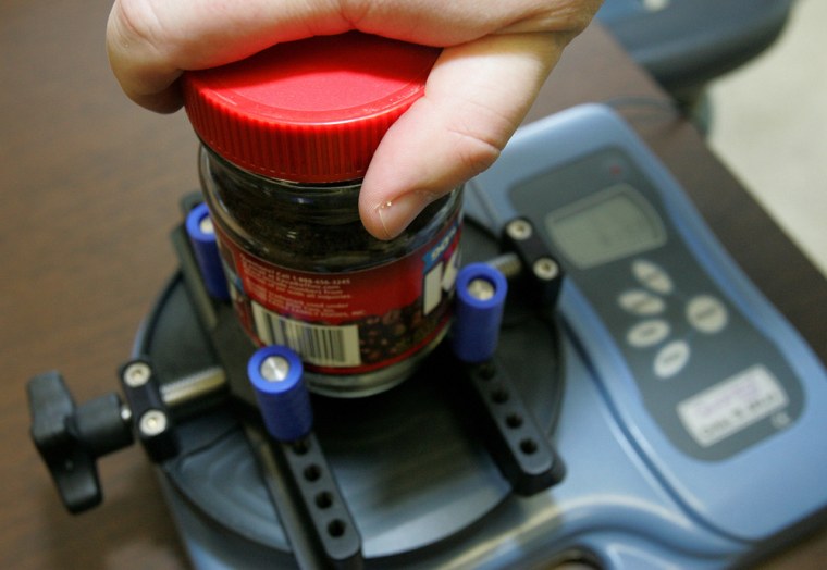 A scientist uses a torque meter to test the amount of energy needed to remove the screw top from a product at the Georgia Tech Research Institute's lab in Atlanta last month.
