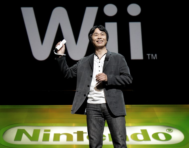 Nintendo General Manager Miyamoto displays Wii remote control device at Electronic Entertainment Expo in Hollywood