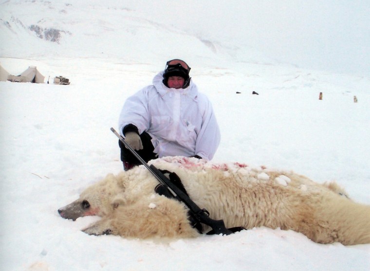 In this undated photo provided by the Canadian Wildlife Service, hunter Jim Martell is seen with a hybrid bear he shot while on a hunting expedition on Banks Island, Northwest Territory, Canada.  According to Dr. Ian Stirling, researcher for the CWS, genetic tests showed the bear had a polar bear for a mother and a grizzly bear for a father.  (AP Photo/Canadian Wildlife Service)