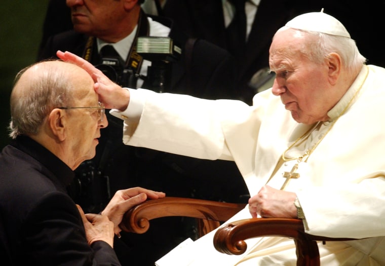 Father Marcial Maciel, founder of the Legionaries of Christ, is blessed by then Pope John Paul II during a special Vatican audience for 4,000 members of the order on Nov. 30, 2004. Following a sexual abuse investigation, Maciel has agreed to abstain from celebrating public masses.