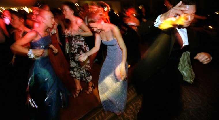 Students dance and party at the Howard High School prom dance.