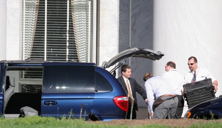 FBI agents load the back of a minivan at the Rayburn House Office Building on Sunday on Capitol Hill in Washington. FBI agents searched the office of Rep. William Jefferson, D-La., who is being investigated in connection with a public corruption scandal. 