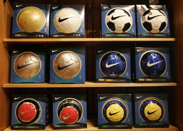 Nike brand soccer balls are on display at a store in Portland