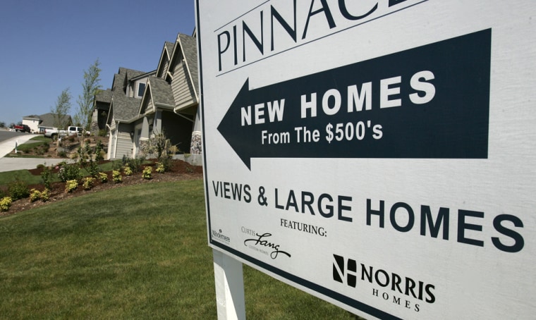 A sign advertises new homes for sale in the Maple Ridge housing development near Seattle on May 16. The median price of a house in the U.S. peaked at $227,000 in the third quarter of 2005, according to the National Association of Realtors.