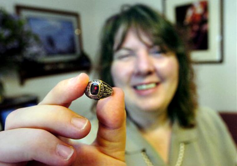 Lisa Peterson of Ammon, Idaho, holds up her high school class ring from Franklin Heights High School in Columbus, Ohio, which was stolen in 1991 on May 22 in Idaho Falls.