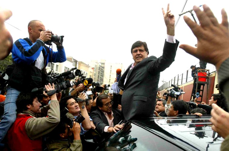 Presidential candidate Alan Garcia waves to supporters in Lima after voting Sunday.
