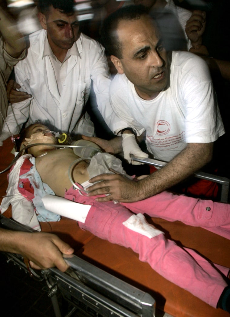 ** FILE ** Maria Amen, a four year old Palestinian girl injured by an Israeli missile strike, is wheeled into the hospital in Gaza City in this Saturday May 20, 2006 file photo. What began as a joyful family trip in a new car came to a devastating end when an Israeli missile, aimed at a Palestinian militant, hit the Amens' Mitsubishi as it drove through Gaza's streets. (AP photo/Hatem Moussa)