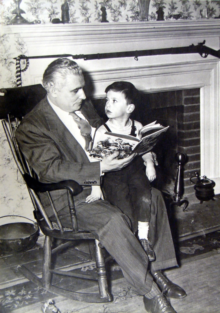 Former Connecticut Senator Thomas Dodd, shares a Grimm's Fairy Tale with his son, now-Senator Chris Dodd of Connecticut.