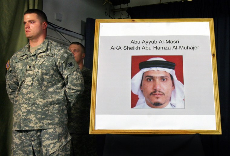A U.S. soldier stands by a photograph of Abu Ayyub al-Masri, allegedly the new leader of al-Qaida in Iraq, in Baghdad on Thursday.