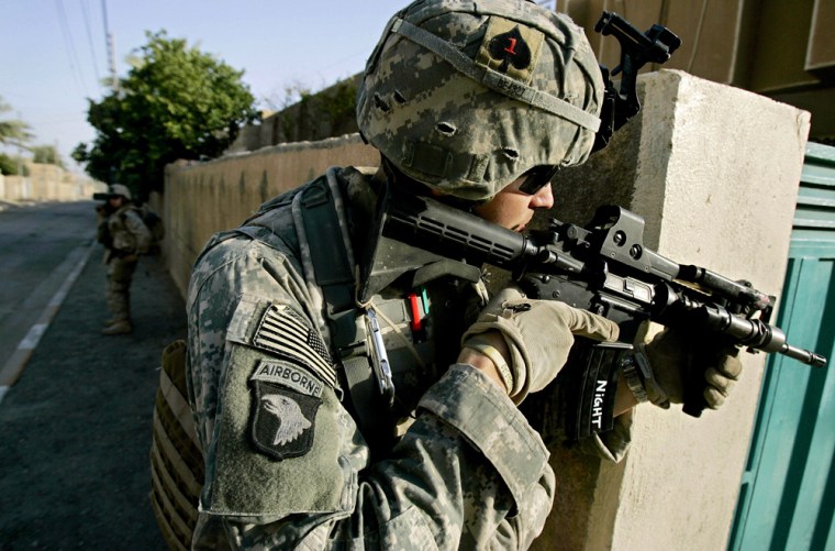 A U.S. Army soldier peers around a corner in eastern Ramadi, 115 kilometers (70 miles) west of Baghdad, Iraq, Monday, June 19, 2006. The U.S. military said Monday it has intensified its search for two missing soldiers, with more than 8,000 Iraqi and U.S. troops deployed across the volatile area south of Baghdad where the men were attacked. (AP Photo/Jacob Silberberg)