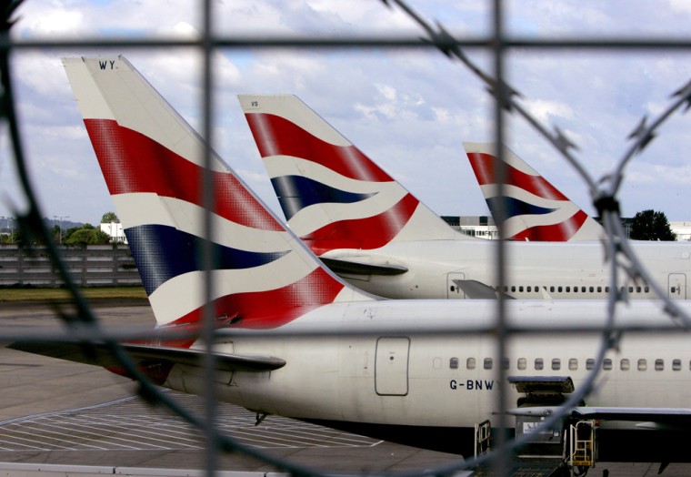 British Airways planes are parked at Heathrow airport, London. U.K. and U.S. agencies are probing alleged price-fixing by BA and other airlines on passenger fares and fuel charges.