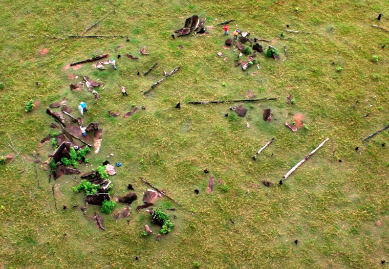 A grouping of granite blocks are seen around a hill like a crown in Amapa, Brazil, on May 10, 2006. A grouping of 127 granite blocks along a grassy Amazon hilltop may be the vestiges of South America's oldest astronomical observatory, according to archeologists who say the find challenges long-held assumptions about the region's prehistory. Anthropologists have long known local indigenous populations were acute observers of the stars and Sun, but the discovery of an actual physical structure that appears to incorporate this knowledge suggest pre-Colombian Indians in the Amazon rainforest may have been more sophisticated than previously suspected. (AP Photo/GOVERNO DE AMAPA, Gilmar Nascimento)