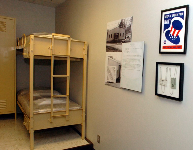 Identification tags, posters encouraging secrecy, and bunk beds used in the fallout shelter are on display in  the bunker at The Greenbrier, in White Sulphur Springs, W.Va., Monday, July 10, 2006. The long-secret fallout shelter built to house Congress after a nuclear attack will reopen to tourists after a two-year renovation that includes construction of an exhibit hall and the first public display of two dozen historic, newly declassified photographs. (AP Photo/Jon C. Hancock)