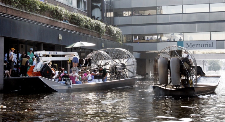 An airboat pulls up to the Memorial Medical Center in New Orleans on Aug. 31, 2005. 