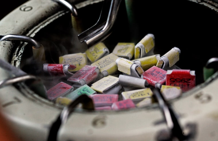 Some frozen bull semen is seen Monday, June 26, 2006, in Brandon, Wis. Artificial insemination is a growing industry in the U.S. and abroad, which allows farmers to breed good traits like fertility and milk quality into their calves and breed out bad ones. (AP Photo/Morry Gash)