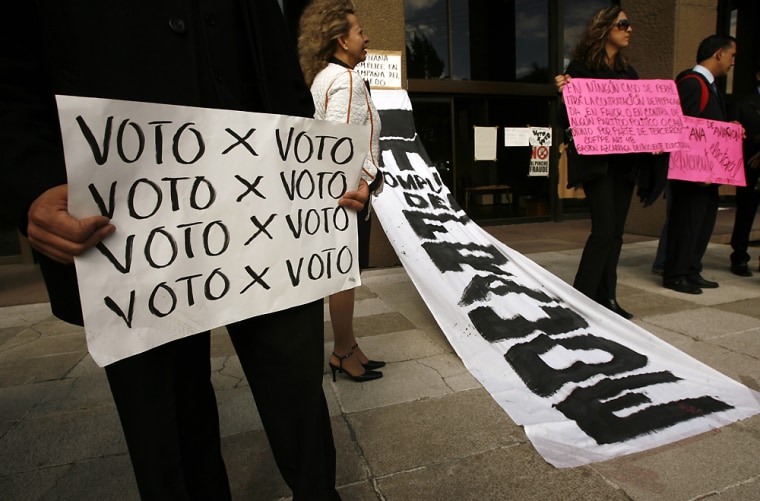 Supporters of presidential candidate Andres Manuel Lopez Obrador protest outside of the corporate offices of Mexicana Airlines in Mexico City, Mexico on Thursday July 20, 2006. Dozens protested to demand a vote by vote recount of the last July 2 presidential elections and accused business leaders of helping swing the elections in favor of the conservative possible winner Felipe Calderon. (AP Photo/Dario Lopez-Mills)