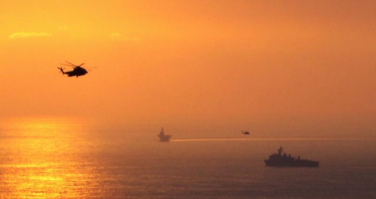 The helicopter evacuation of Beirut at sunset.