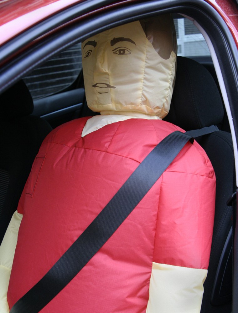 Handout picture of blow-up man sitting in a car